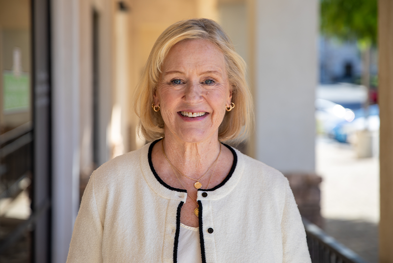 Redland Family Dental Care patient Cindy smiling outside