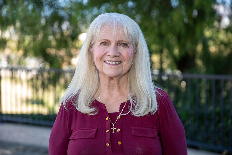 Redland Family Dental Care patient Tina smiling outside